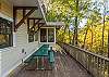 Main level deck w/ picnic table overlooking creek.