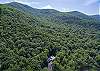 Aerial of One Acre Wood and surrounding mountains.