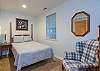 Bedroom on lower level w/ double bed.