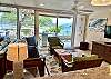 View from Kitchen to the lanai. Beautiful beach and ocean views. Can't get any closer to the beach!