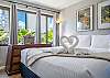 Wake up to sunlight and soft island breezes in this cozy bedroom, featuring thoughtful design and bright, restful tones.