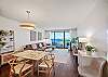 The four-seat dining area opens directly to the living room and furnished lanai/balcony, creating an easy everyday flow with ocean and marina views for meals, conversation, and extended stays at The Watermark Waikiki.