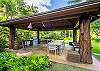 The Watermark Waikiki’s shared outdoor barbecue pavilion features built-in grills, dining and lounge seating, and tropical landscaping, providing a pleasant option for open-air meals during an extended stay.