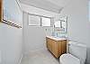Bright and thoughtfully updated, this second bathroom offers modern finishes and natural light, enhancing comfort during your Honolulu getaway.