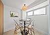 Share meals or plan your Waikiki adventures around this cozy dining table, set beneath warm lighting and surrounded by clean, modern island-inspired design.