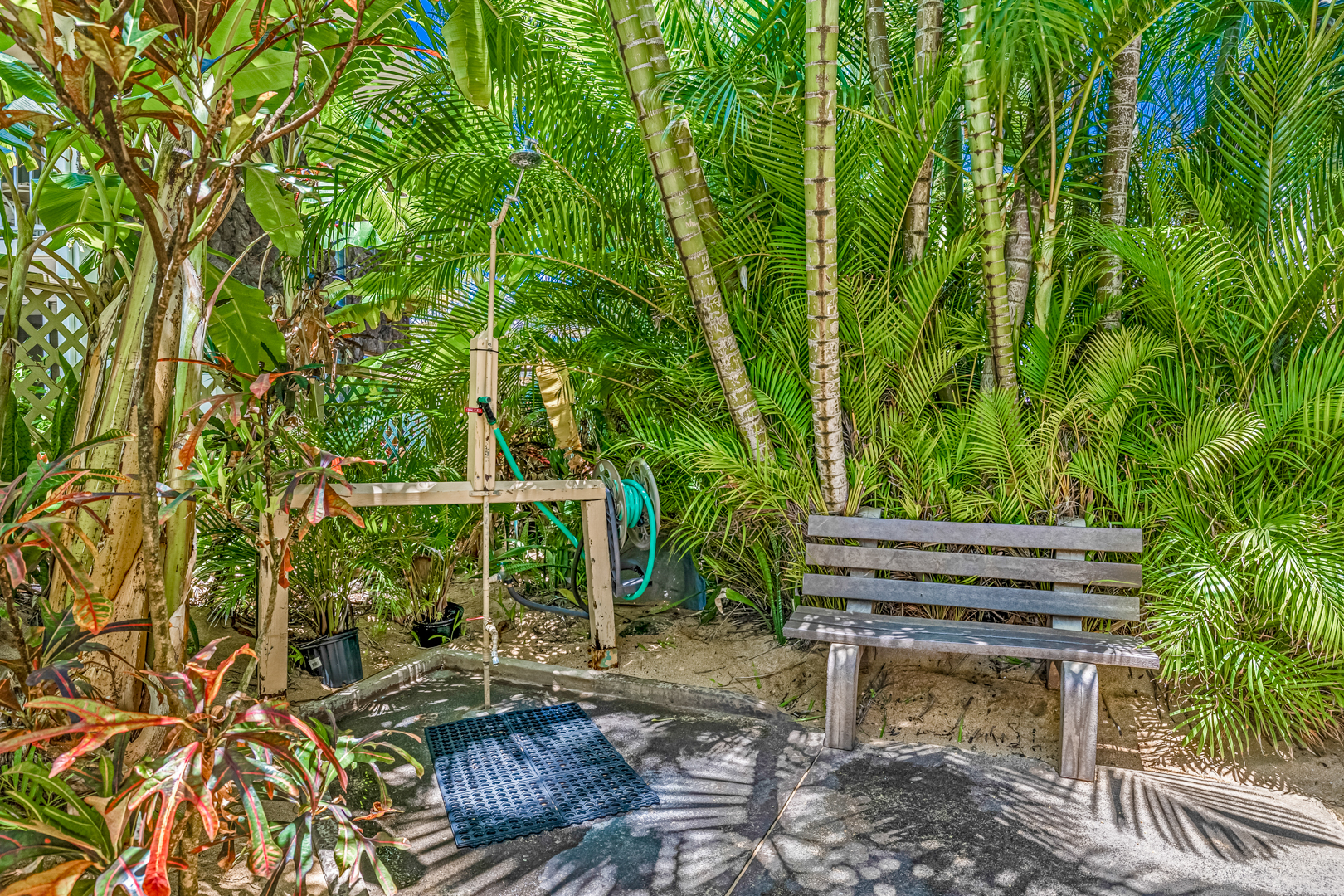 Community outdoor shower on the beach path inside the gate