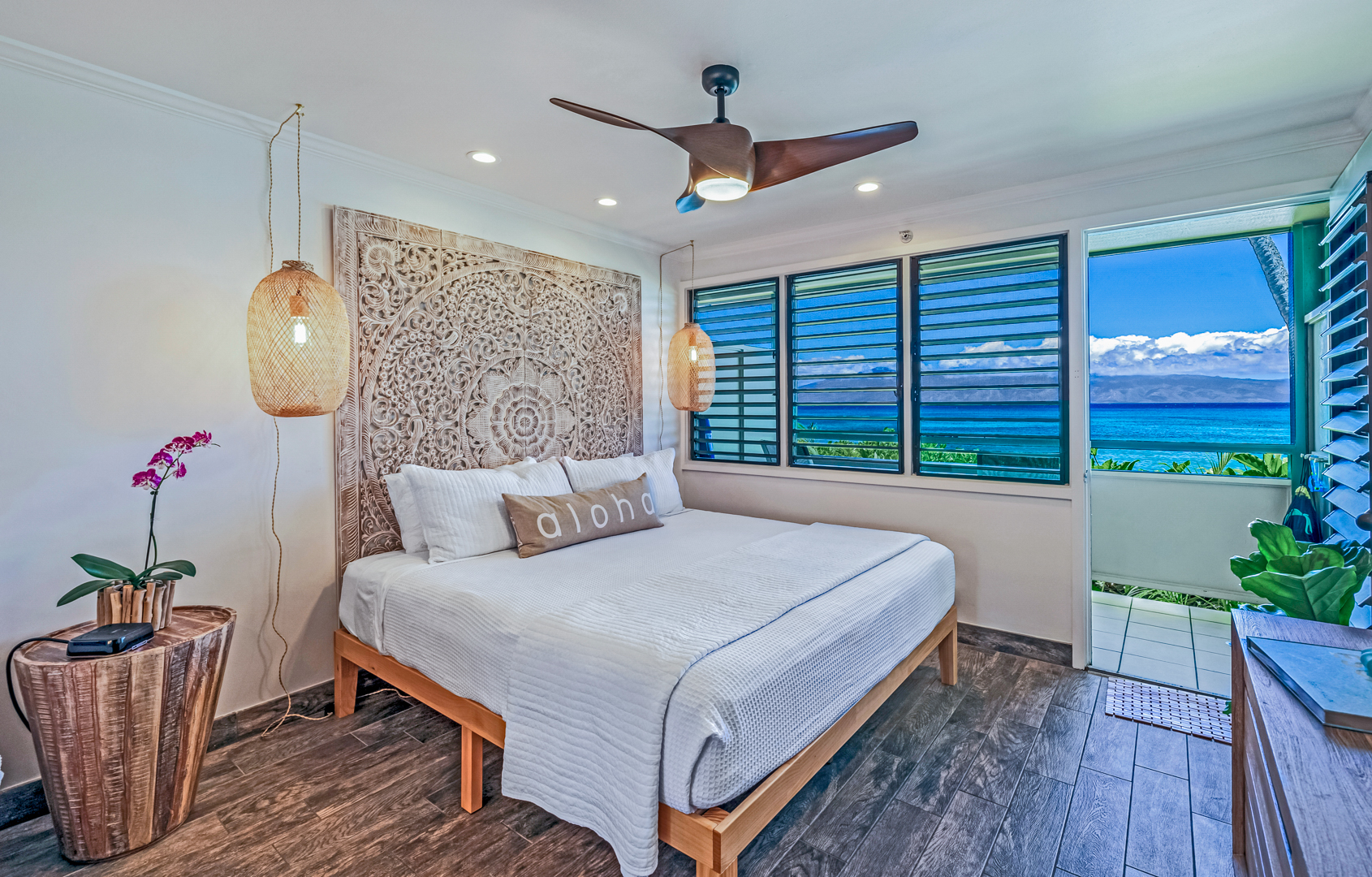 Plush King bed with views of Napili Bay.