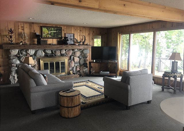Living room with fireplace and views. 