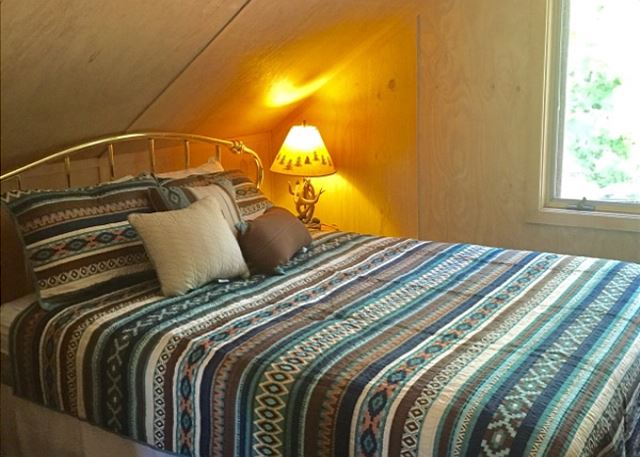 Upper level bedroom with full bed
