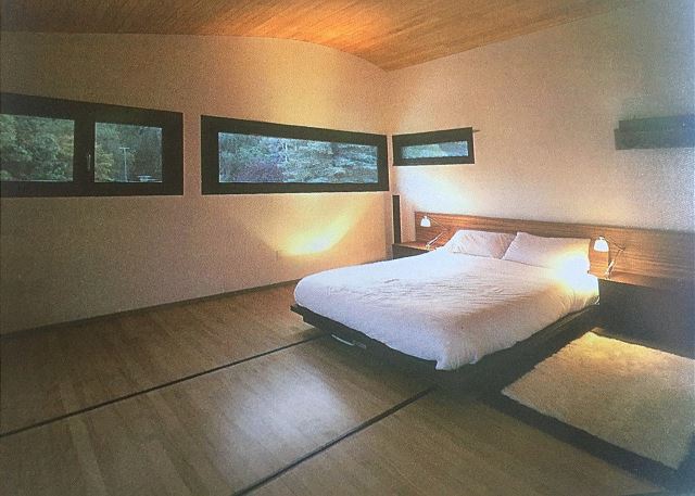 King size bed in bedroom. 
