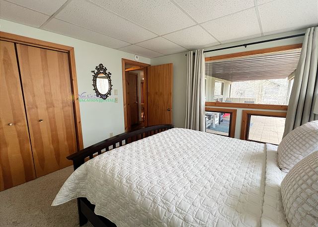 Lower-level bedroom with queen bed