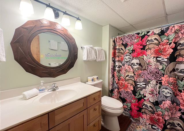 Lower-level bathroom with shower/tub. 