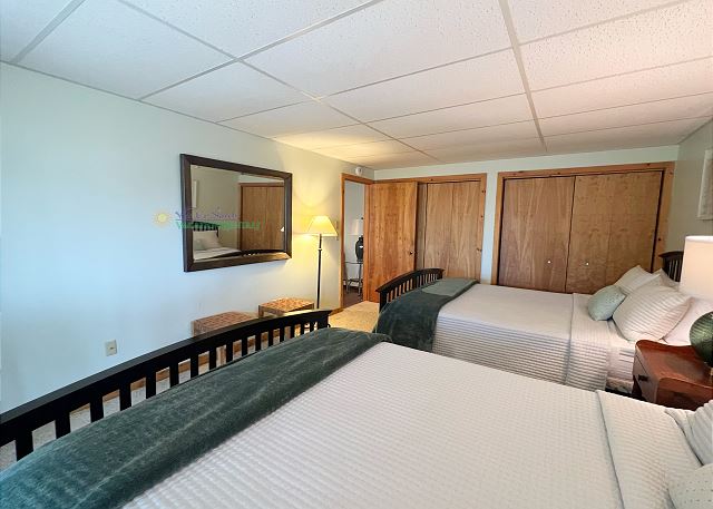 Lower-level bedroom with two queen beds