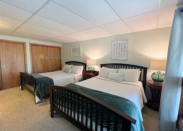 Lower-level bedroom with two queen beds