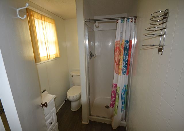 Bathroom with stand up shower.