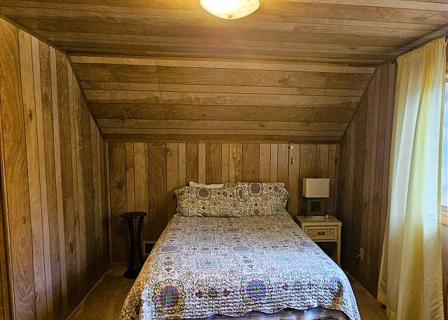 Upstairs bedroom with queen bed and two twins