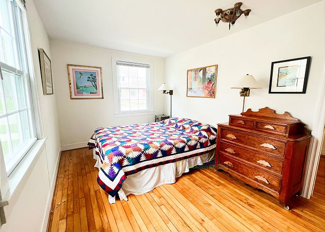 Main level bedroom with queen bed.