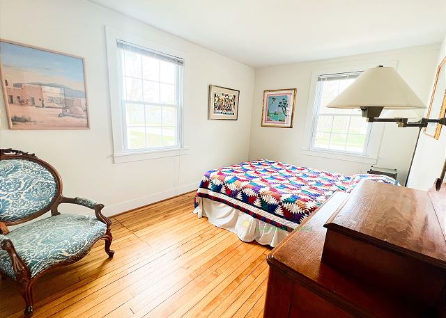 Main level bedroom with queen bed. 