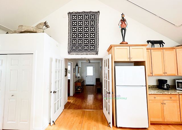 View from kitchen to front entry. 