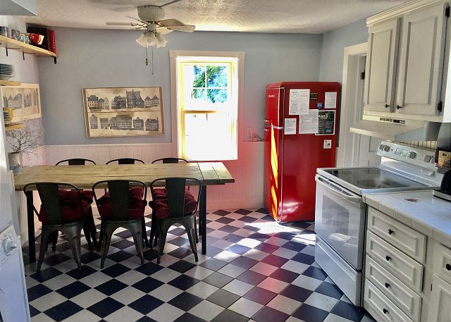 Full kitchen with dining area.