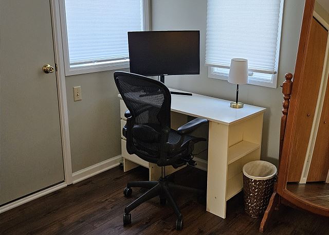 Computer monitor in downstairs queen bedroom