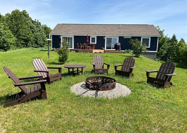  3+ private acres, deck, outdoor chairs, gas grill, fire pit, corn hole.
