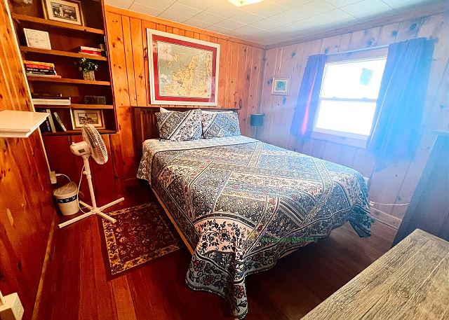 Bedroom with queen bed.