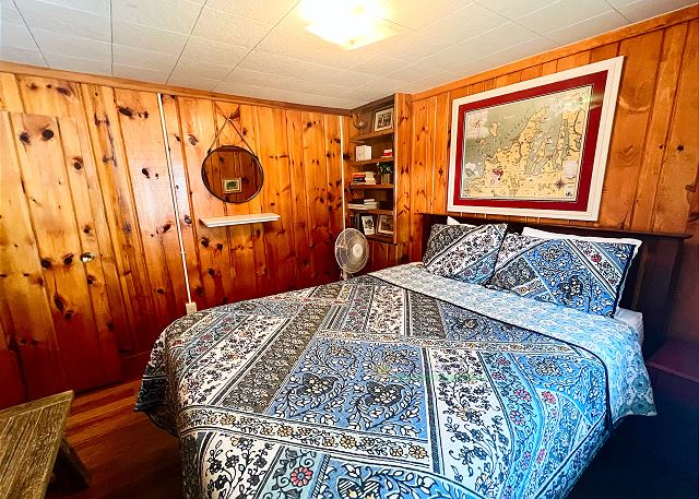 Bedroom with queen bed. 