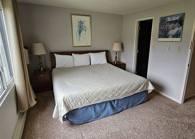 Upper-level bedroom with king bed