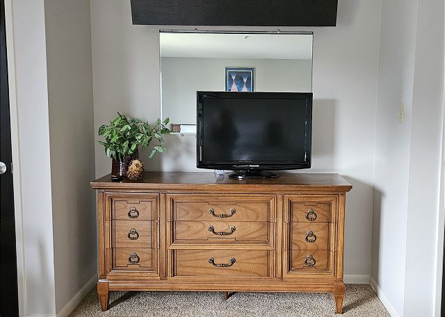 TV in upper-level twin bedroom