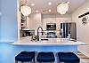 Cozy counter seating & open kitchen brings everyone together.