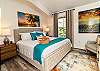 Unwind in style in this plush and inviting king bedroom with luxurious linens.