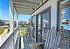 The balcony with a beautiful view of the ocean and pool 