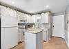 Updated Kitchen with Island, lighting under the cabinets and Keurig