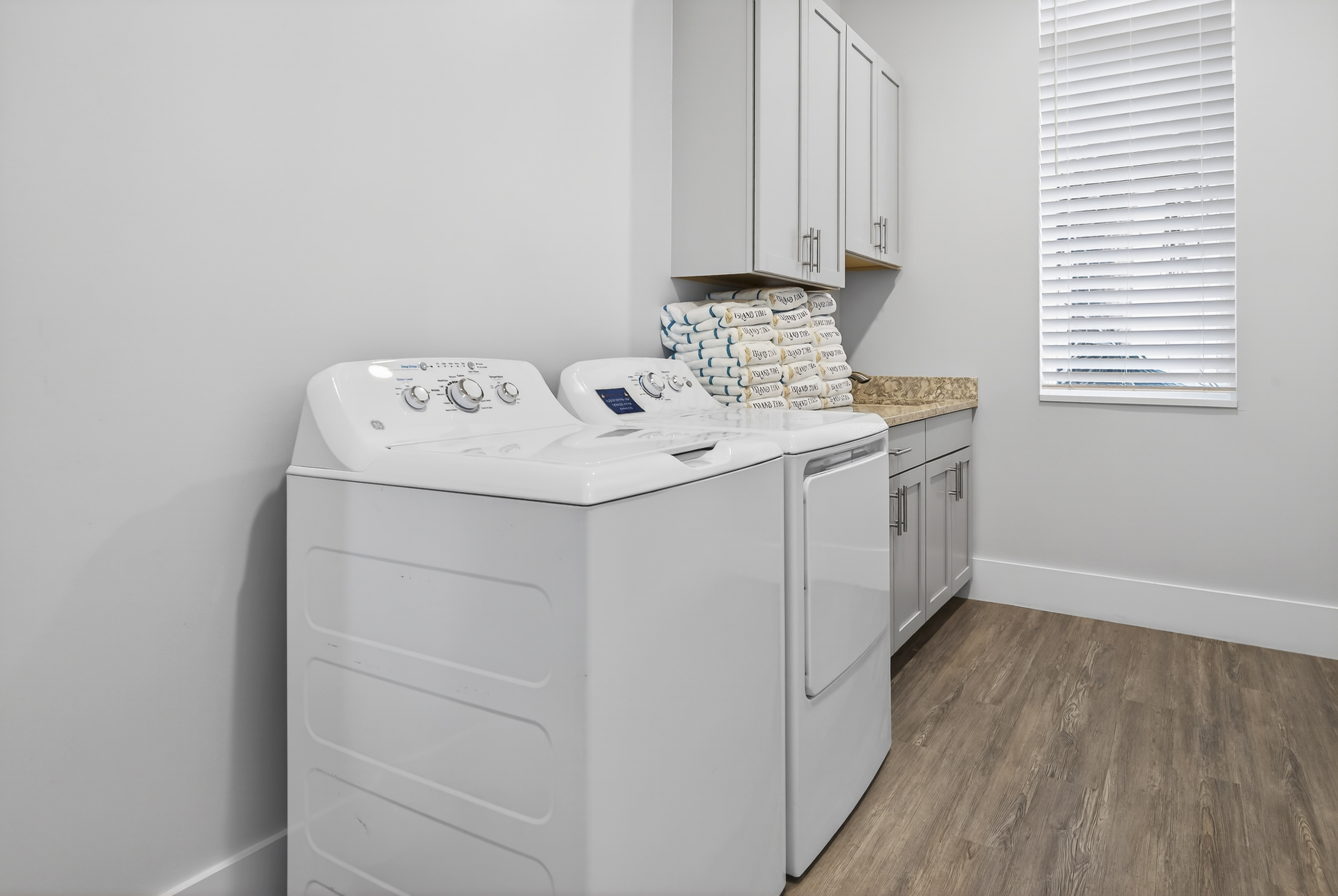 103 Dune Lane | Laundry room w/ Island Time Pool Towels 