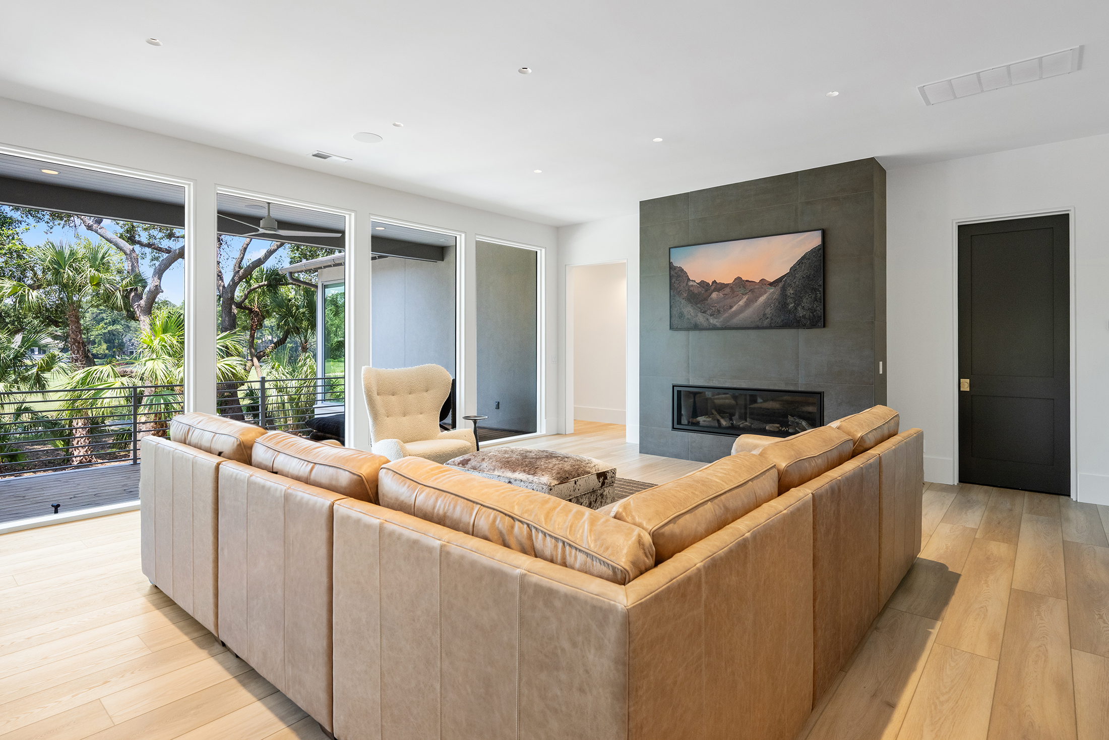 49 Sea Lane | Spacious living room w/ fireplace & fairway views