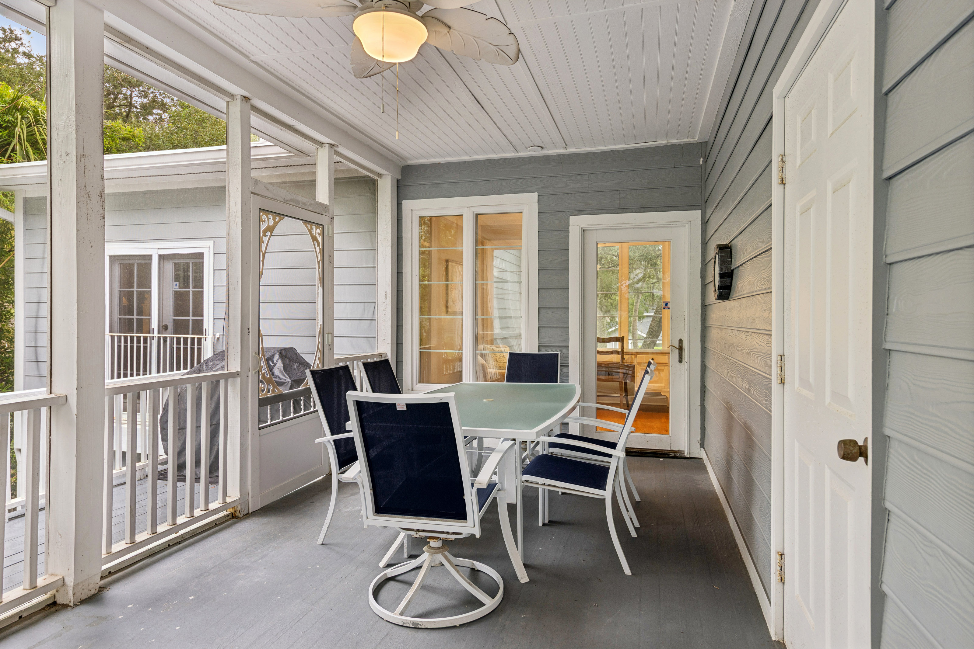 66 Dune Lane | Screened in porch w/ seating & ping pong
