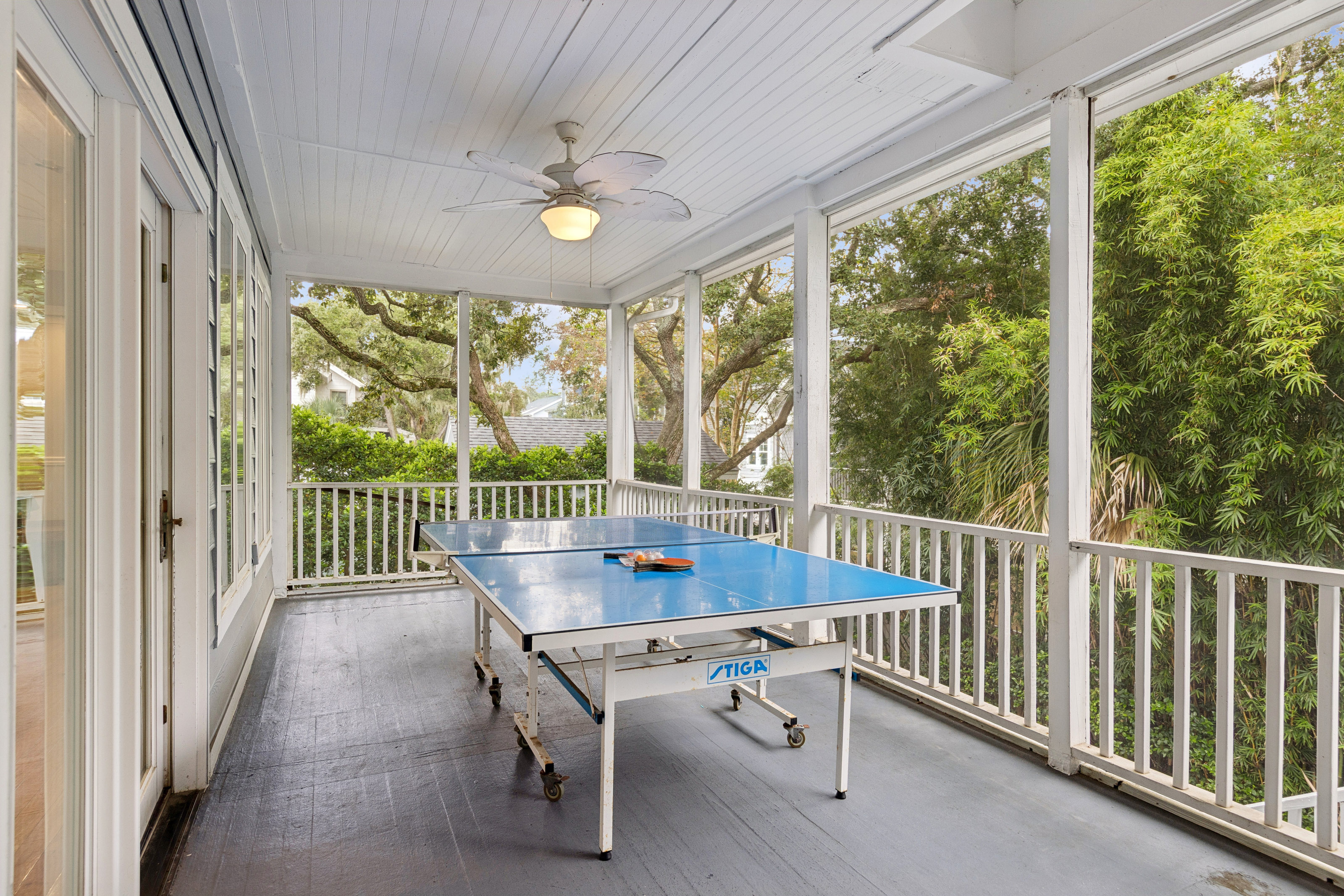 66 Dune Lane | Screened in porch w/ seating & ping pong