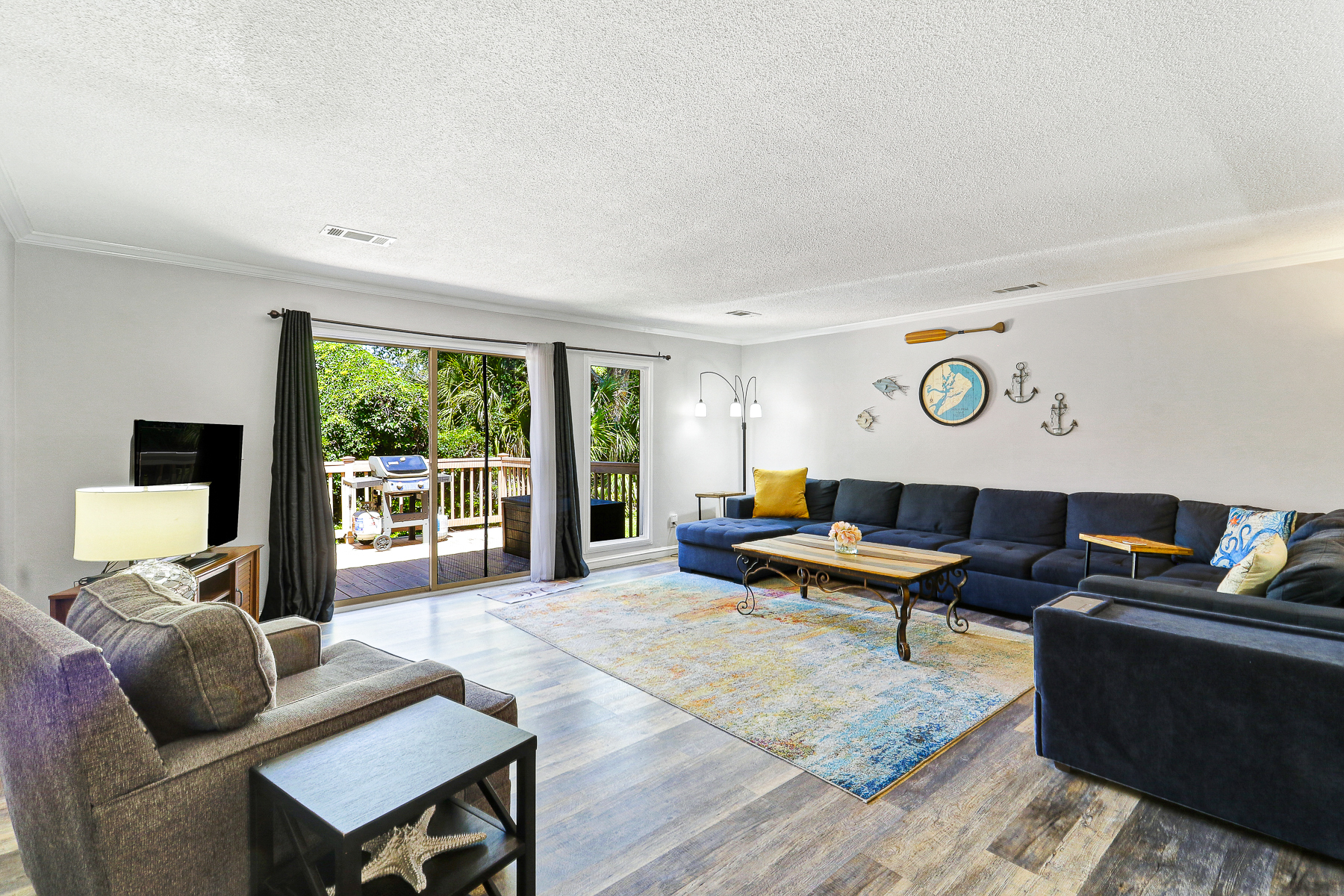 677 Queens Grant | Spacious Living room w/ TV & Deck Access