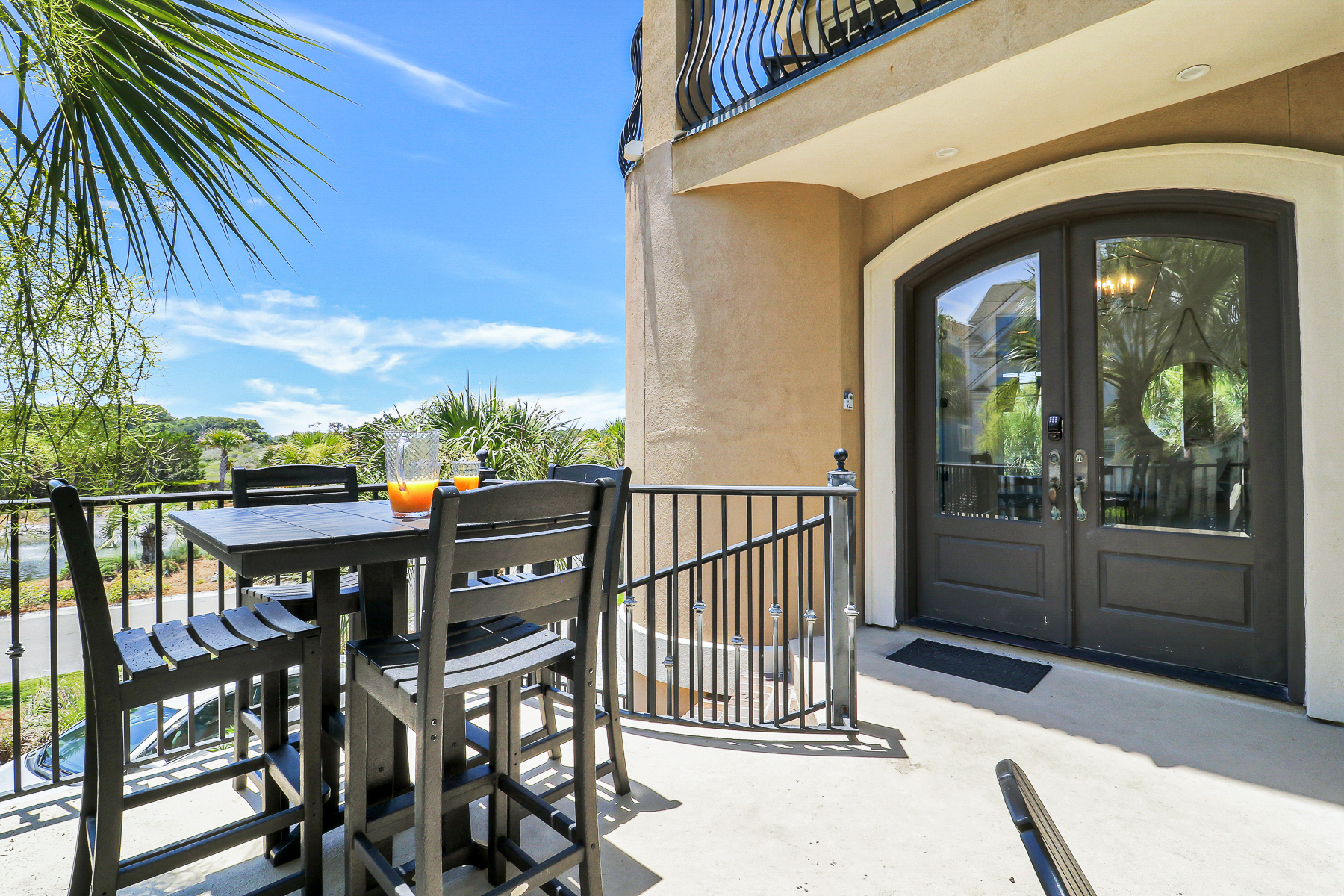 1 Collier Beach Road | Poolside lounge chairs and 4 seat table