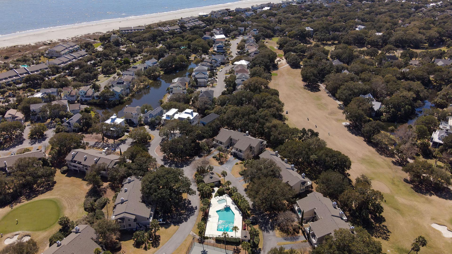 Aerial view of neighborhood and community pool