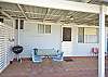 Outside undercover area with seating and BBQ