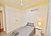 Minor bedroom with single bed, aircon & ceiling fan