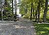 Driveway leading down to lake and private dock