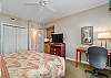 Guest bedroom features a king size bed, private balcony, 3 fixture bathroom, microwave, and refrigerator.