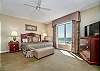Spacious master bedroom with direct ocean front view and access to the balcony!