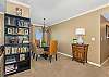 The bookcase beside the dining area has books and games for the family!