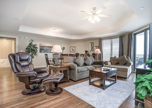 This condo is warm and inviting with rich honey toned wood floors and gorgeous décor to match.