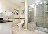 Located across the hall from the guest bedrom, the three piece guest bath has a sizable glass enclosed shower.