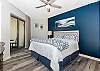 The master bedroom is charming - it features a king sized bed and has access to the balcony.